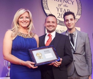David Vaughan and Mike Everett collect the prize for Best Small Estate Agency of the Year from businesswoman Michelle Mone