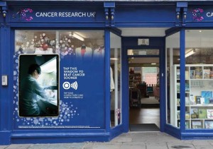 Cancer Research UK contactless giving shop window