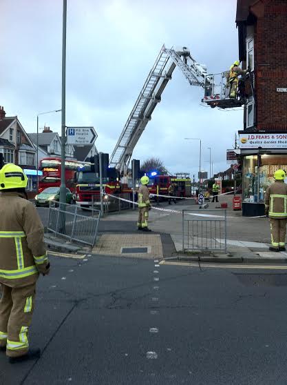 Firefighters make swaying cast iron drain pipe safe at busy Hove crossroads