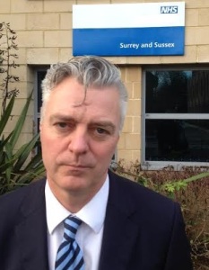 Simon Kirby outside NHS England Surrey and Sussex offices