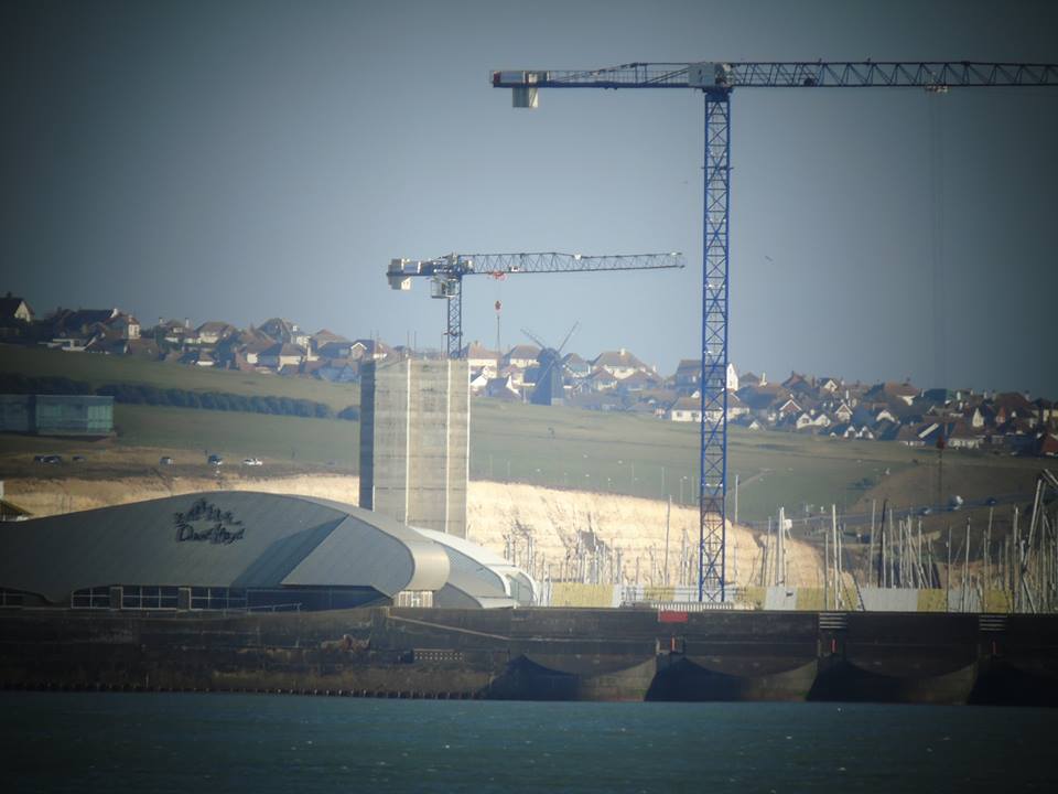 First towerblock at Brighton Marina begins to peek above the cliffs