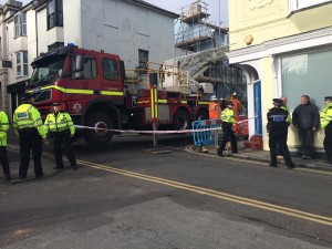 Firefighters attend after the collapse of the house 