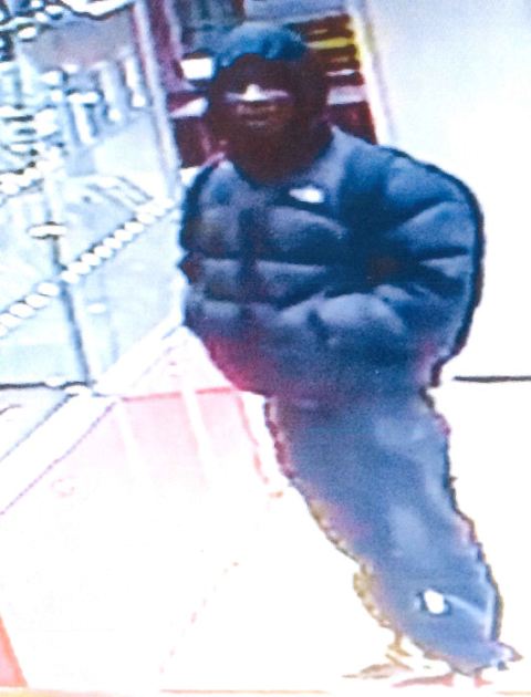 Robber threatens mobile phone shop staff with large kitchen knife