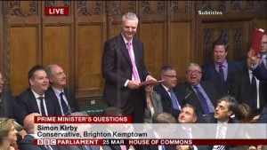 Hove MP Mike Weatherley looks on as Simon Kirby, the MP for Brighton Kemptown, speaks at Prime Minister's Questions