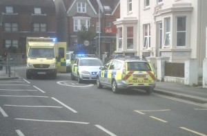 Police and ambulance attend the patient