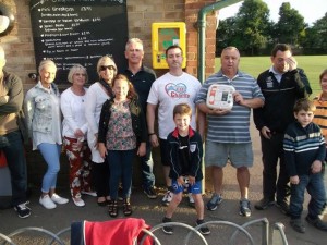 Residents learn how to use the newly purchased defibrillator - in the yellow box - in Wish Park