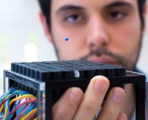 PhD student Asier Marzo uses a tractor beam to levitate a polystyrene ball with soundwaves
