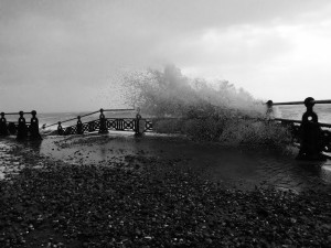 Storm force winds send waves and pebbles crashing on to the Hove seafront promenade