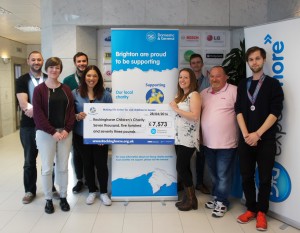 Domestic and General staff hand over £7,500 to the Rockinghorse sick children's charity