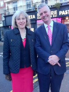 Theresa May and Simon Kirby in St James's Street, Brighton, after visiting the AIDS Memorial in New Steine