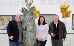 Steve Darby and Peter Hollett from City Cabs 205205 Brighton Taxis help Rockinghorse head of fundraising Analiese Doctrove to deliver an 8ft Christmas tree to the Royal Alexandra Children's Hospital in Brighton