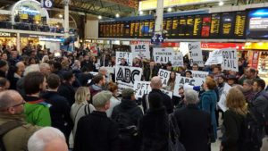 Commuters protest about the dire train service during the long-running industrial dispute