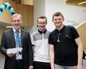 BACA principal Dylan Davies congratulating students on their exam results last summer