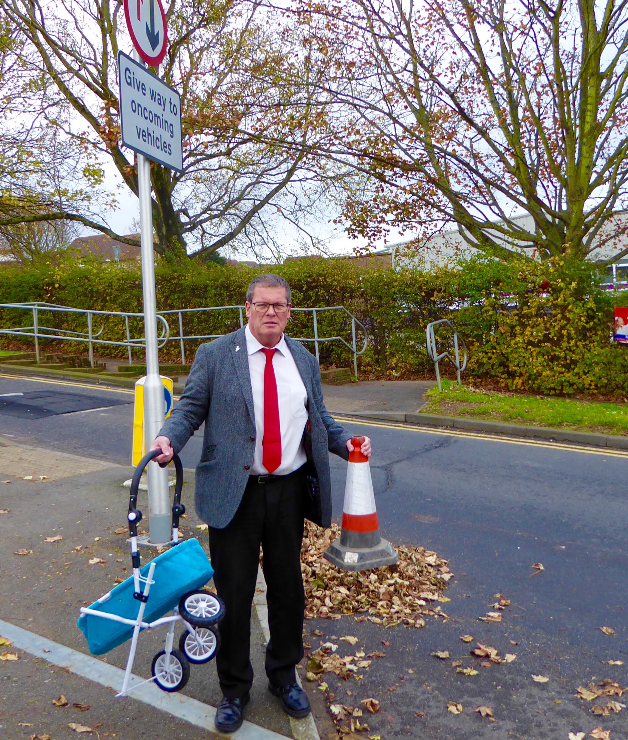 Councillor Peter Atkinson with items thrown in front of cars in North Portslade