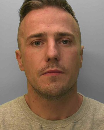 Knife thug jailed for stabbing woman