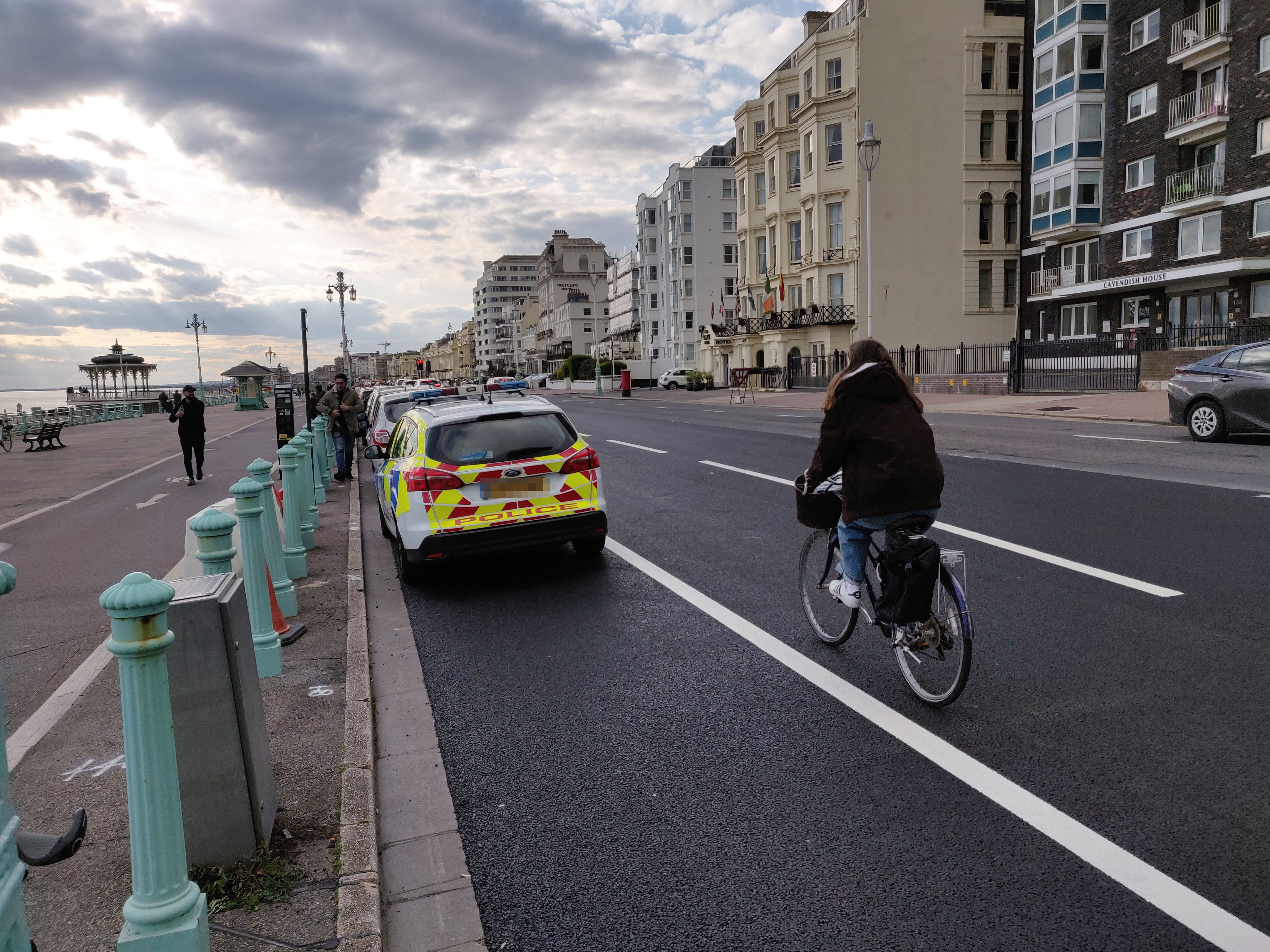 Parked police cars help clog up seafront cycle lane after wands removed for resurfacing