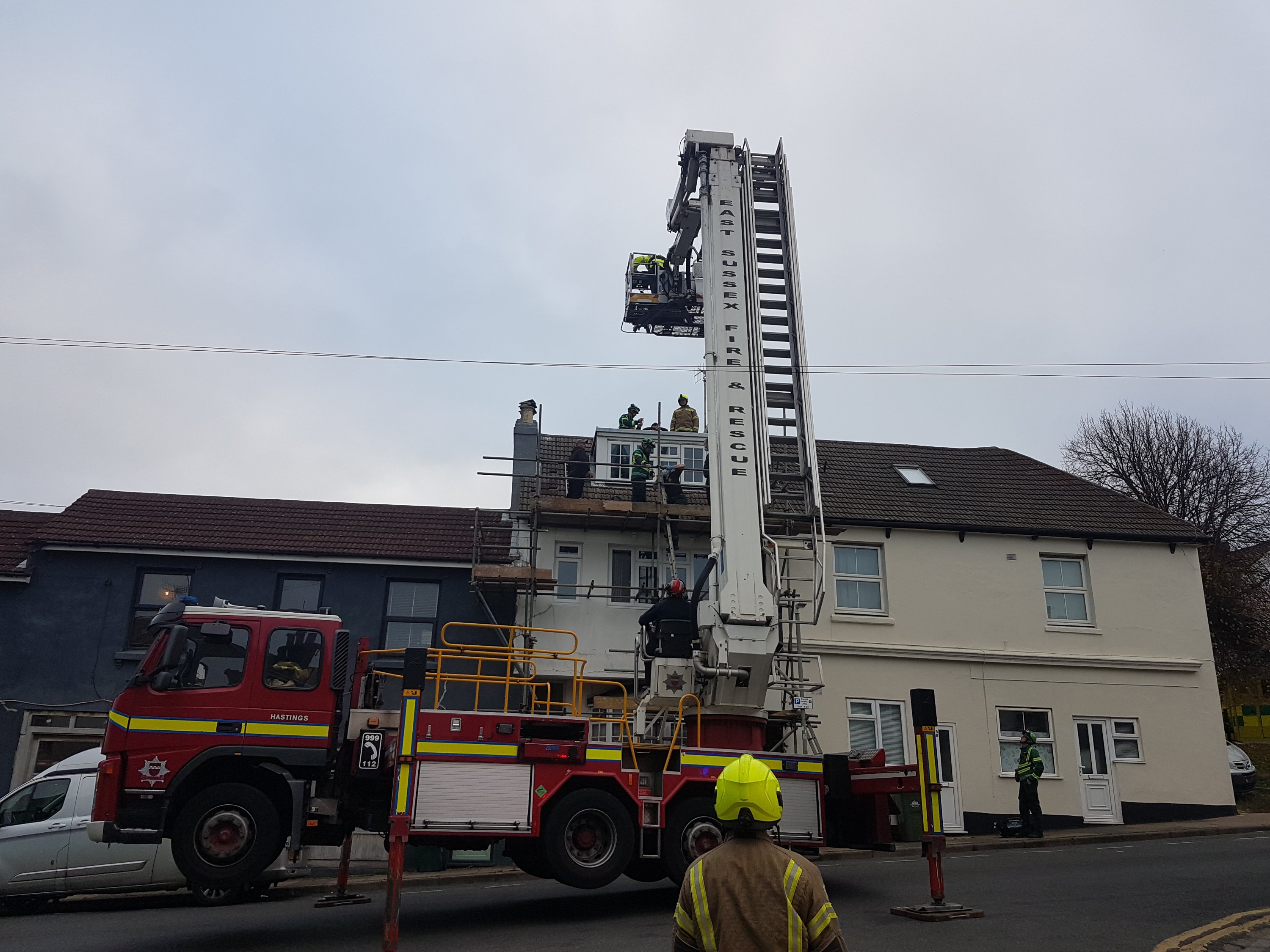 Builder rescued from roof after fainting