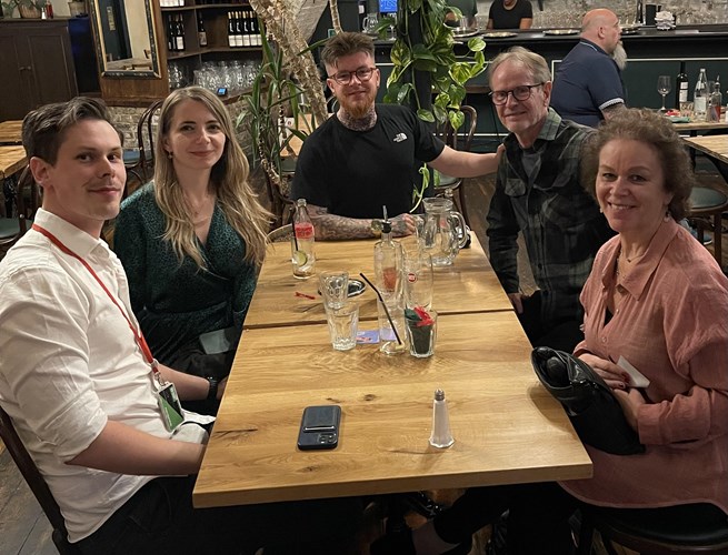 Adam, centre, with his dad Graham and mum Dianne on the right