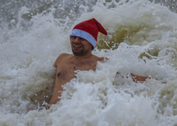 Hundreds turn out for Christmas Day swim in the sea