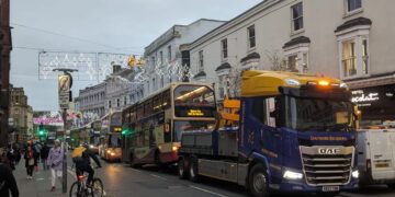 Broken down bus towed from busy high street