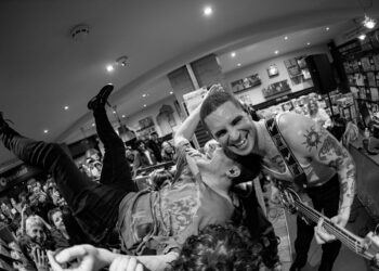 Crowd surfing and moshing in Brighton record shop