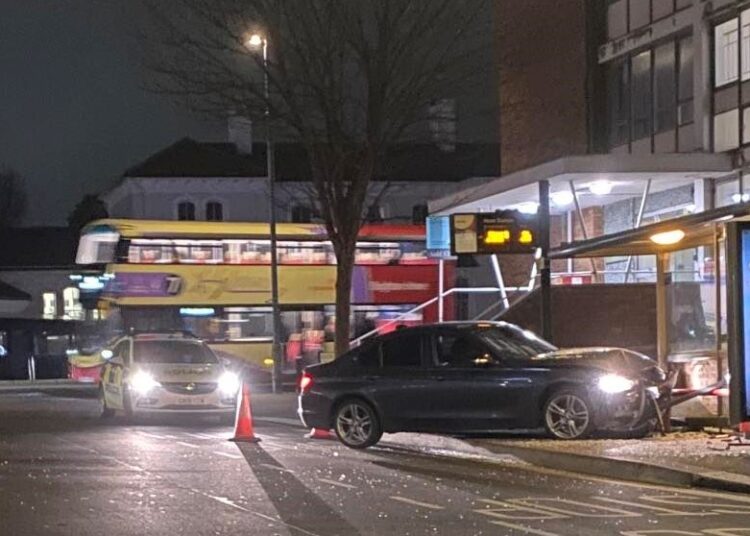 Driver flees after crashing car into bus shelter