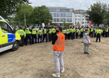 Women shelter in shop after protesters tail them from rally