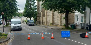 Woman seriously injured after being hit by minibus
