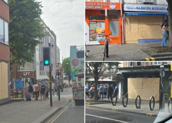 City centre businesses board up amid race riot reports