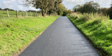 Pothole-strewn road finally repaired
