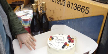 Cycling campaigners thank bike lane builders with cake and fizz