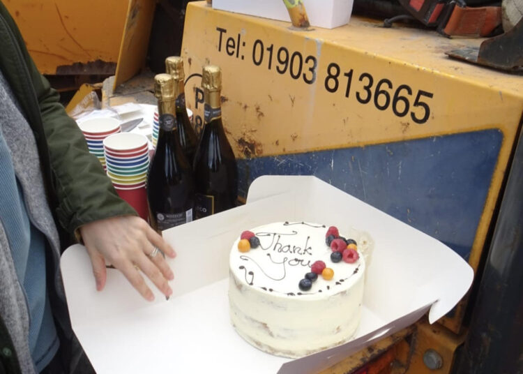 Cycling campaigners thank bike lane builders with cake and fizz