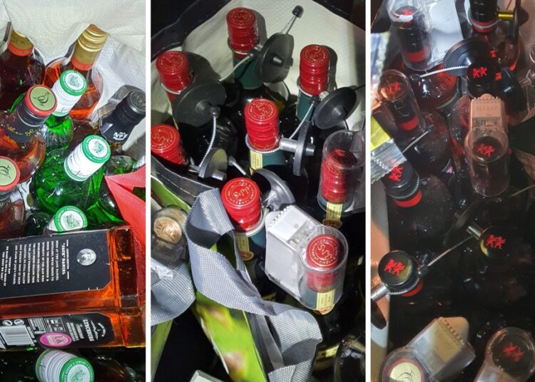 Two men charged with stealing bottles of drink worth thousands