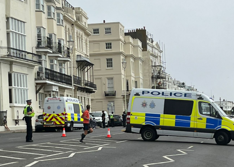 Seafront main road closed as man throws belongings from flat