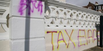Deputy PM’s Hove flat graffitied amid tax evasion claims
