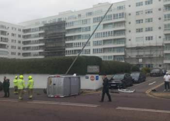 Van ends up side in coast road crash