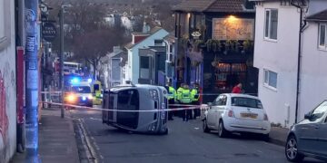 Brighton road closed after car flip