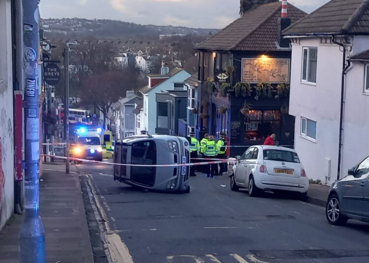 Brighton road closed after car flip