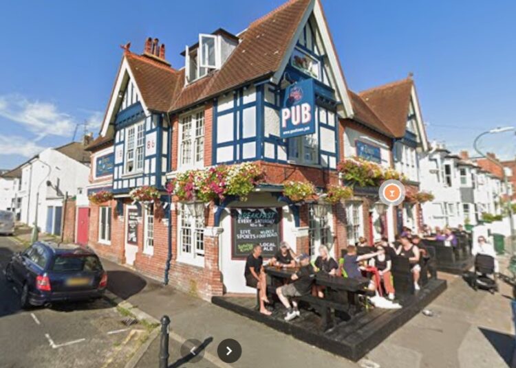 Three charged over Hove pub shooting