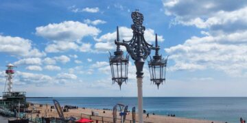 First of Brighton’s restored old streetlights goes back up on the seafront
