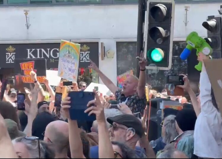 Fatboy Slim entertains protesters outside Brighton station