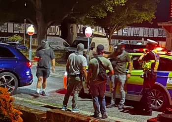 Police car crashes into parked cars