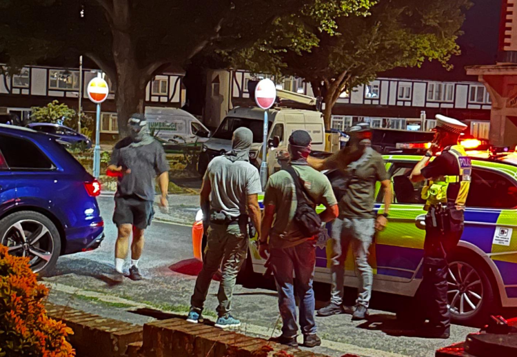 Police car crashes into parked cars
