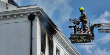 Fire crews battle flat fire