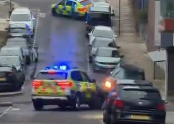 Mini rams two police cars